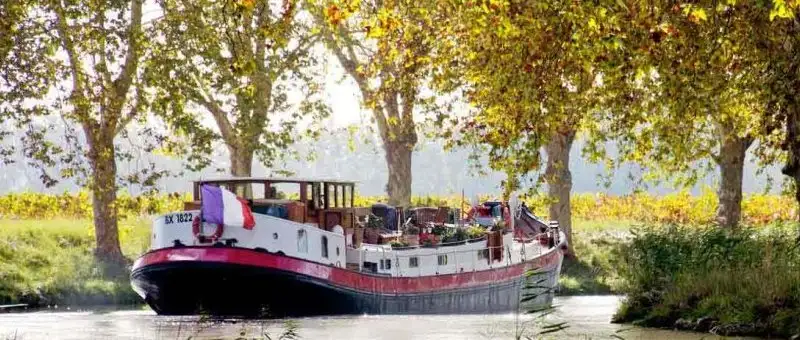 Superbe péniche navigante 120 m² à vendre sur le Canal du Midi